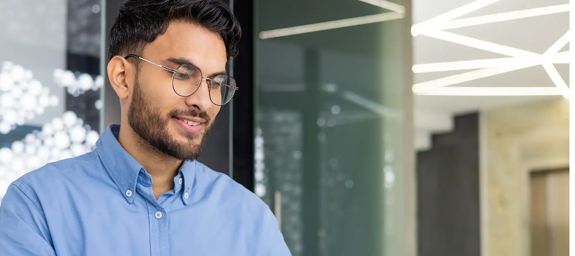 young businessman working in modern open plan office
